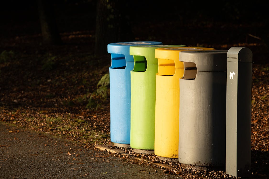 Colourful recycling bins sorted by type in a public area